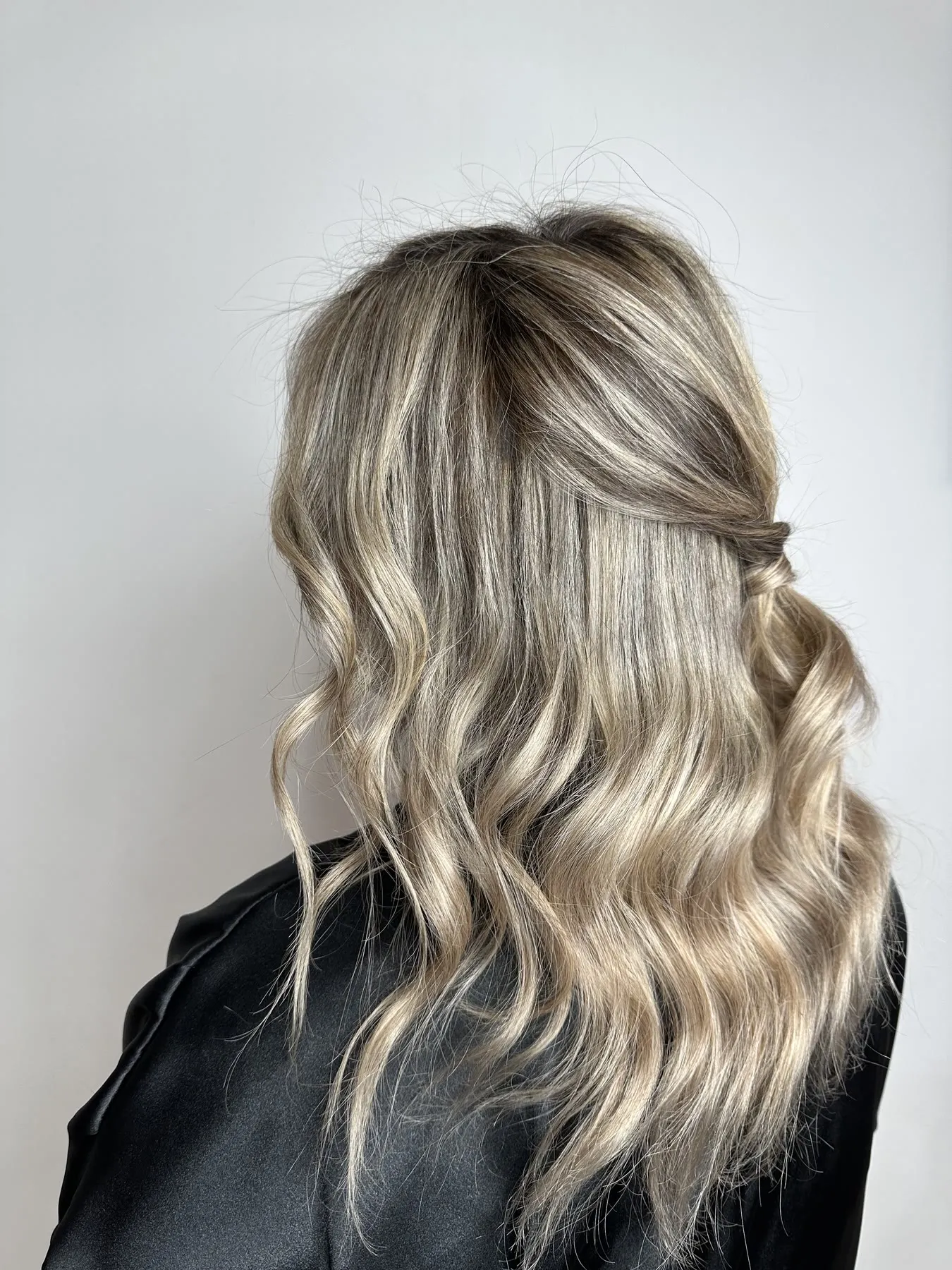 Half-up ash blonde waves by Ronak Hairstylist in Toronto