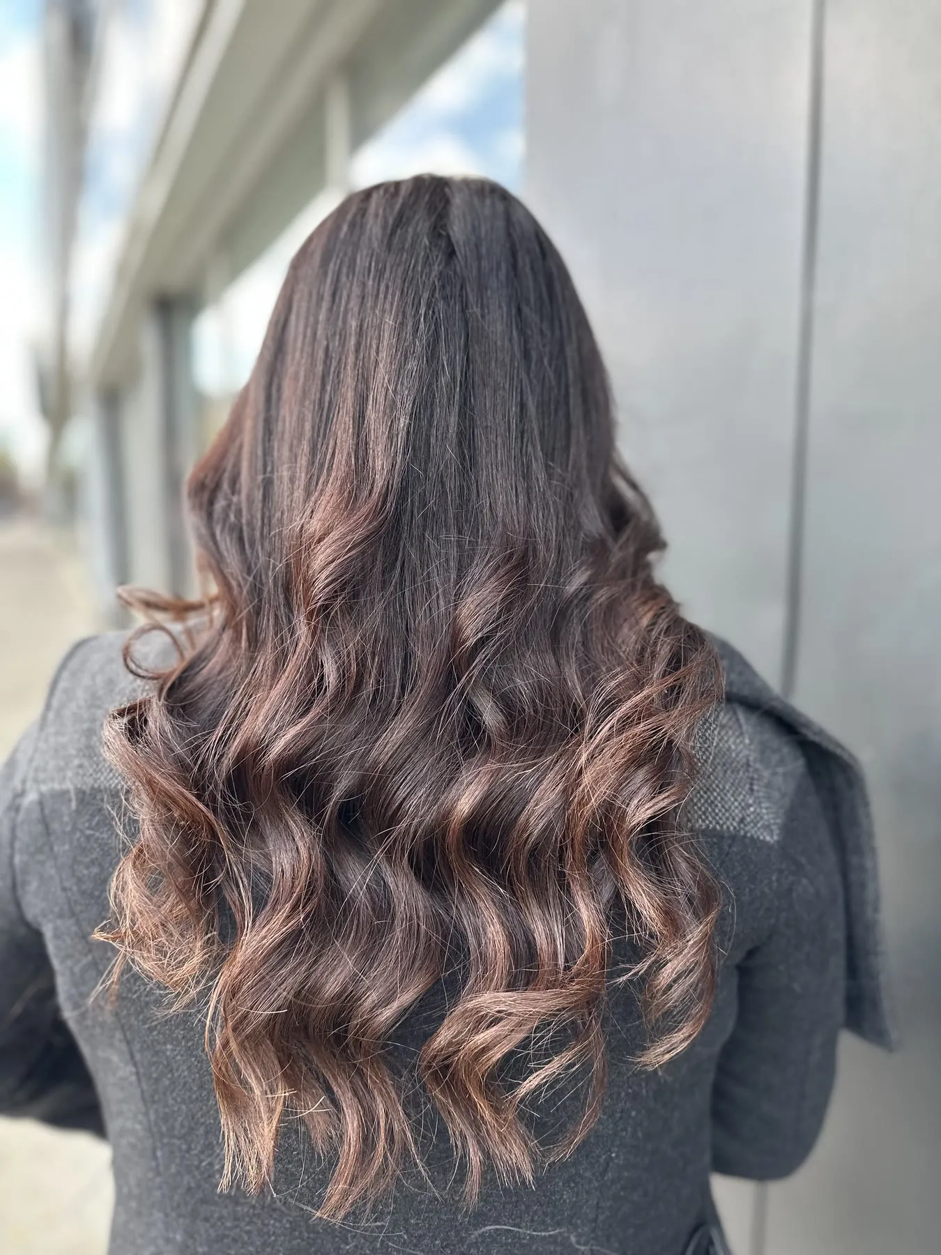 Chocolate brown with copper-red waves by Ronak Hairstylist in Toronto