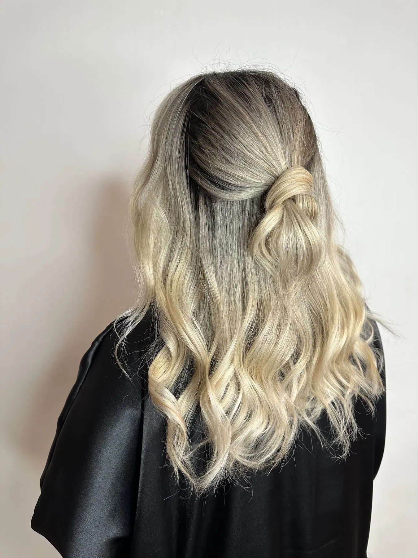 Half-up blonde balayage with a shadow root by Ronak Hairstylist in Toronto