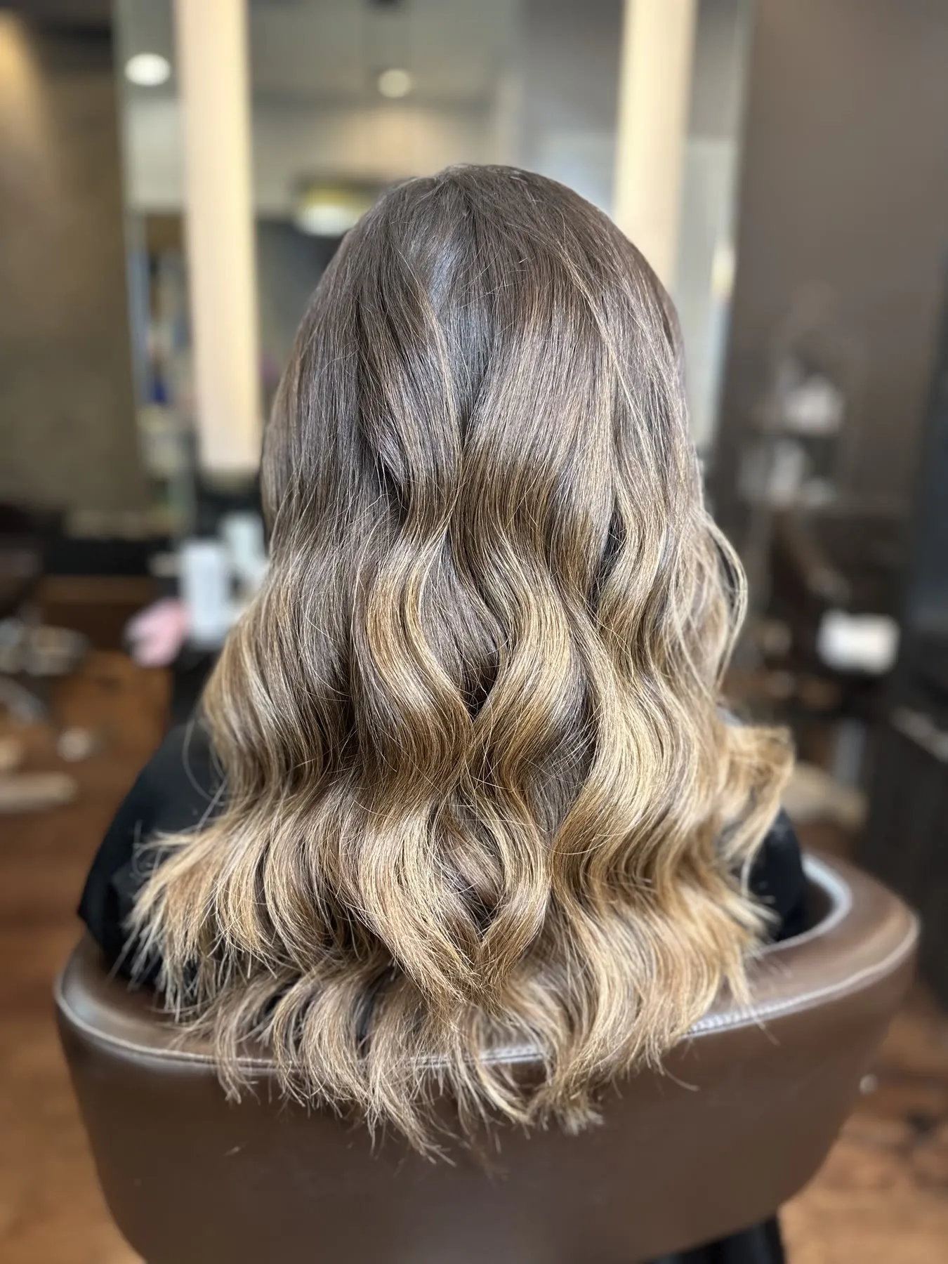 Bronde balayage on long waves by Ronak Hairstylist in Toronto