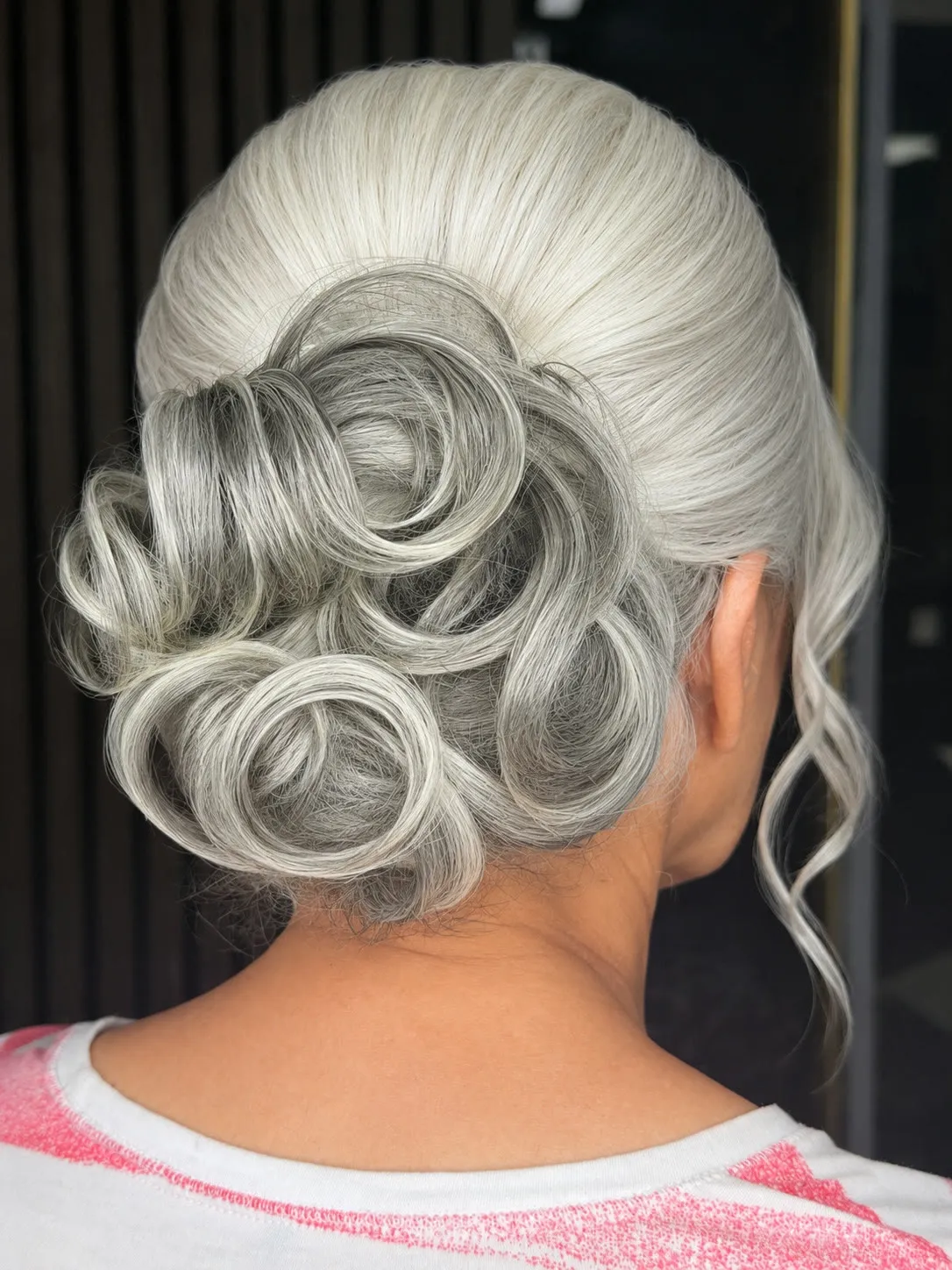 Sculpted silver-white updo with pin curls, back view, by Ronak Hairstylist in Toronto