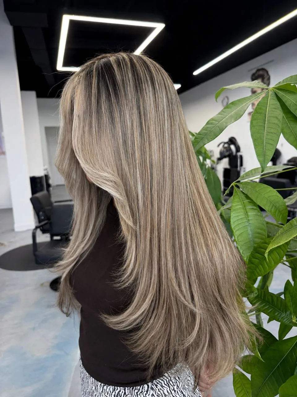 Ash blonde highlights with a soft shadow root by Ronak Hairstylist in Toronto